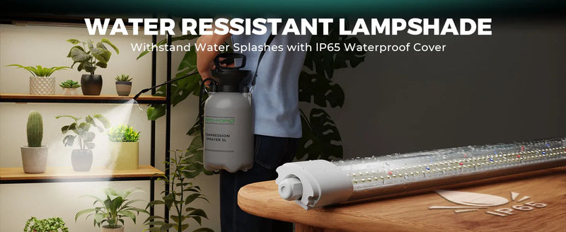 White cylindrical LED tube light with end cap on a wooden table beside a sprayer and indoor plants