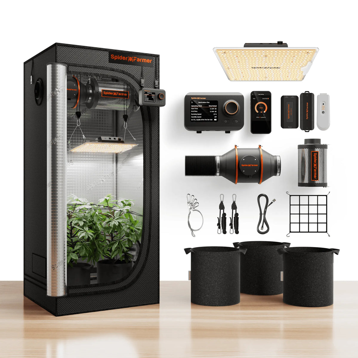 Indoor grow tent with plants, LED panel, ventilation fan, controller, carbon filter, fabric pots, and hanging accessories