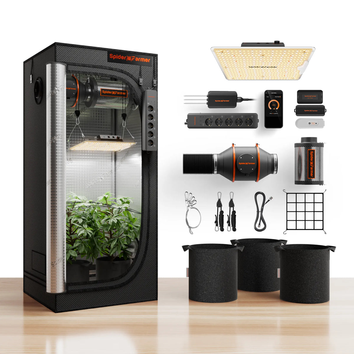 Indoor plant grow tent with reflective lining, LED light, ventilation fans, fabric pots, and hanging accessories