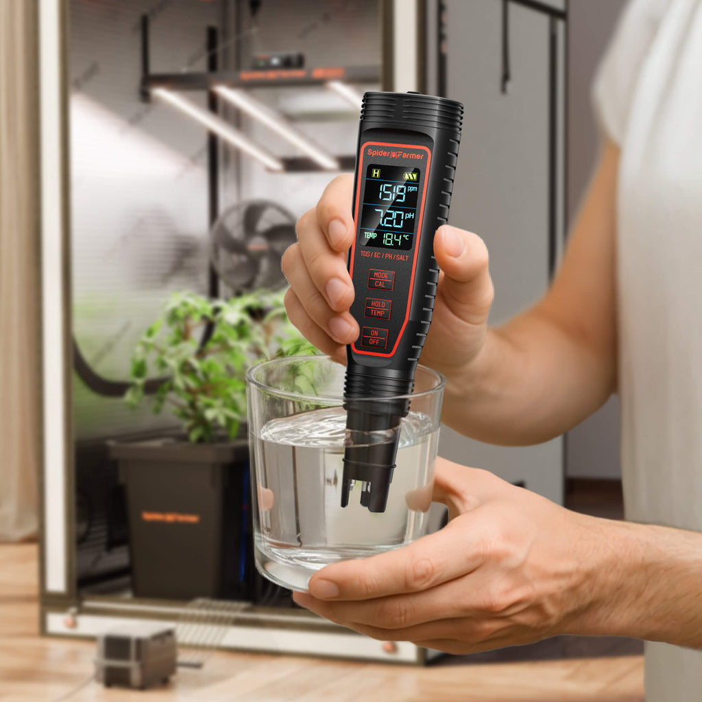 Spider Farmer 5-in-1 pH and EC meter in black measuring water quality — precise readings displayed on a digital screen.
